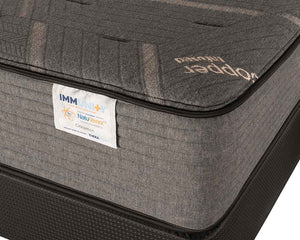 Close-up of Cinnamon Firm mattress shown on a foundation; foundation not included